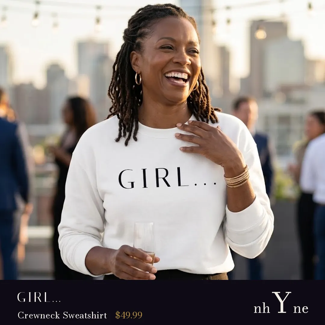 A laughing woman in a white GIRL… crewneck